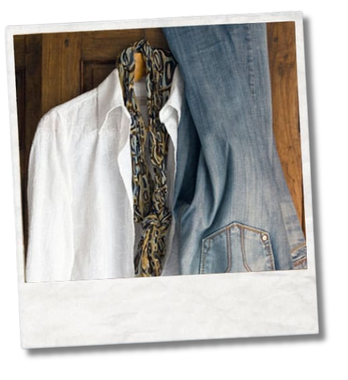 White shirt, patterned scarf and denim jeans hanging together